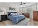 Comfortable bedroom with a bed, classic wood furnishings, and natural light from the window at 69 Via Di Mello, Henderson, NV 89011