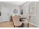 Cozy breakfast nook featuring a round table and stylish upholstered chairs near bright windows with shutters at 69 Via Di Mello, Henderson, NV 89011