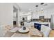 Bright dining area adjacent to the kitchen with comfortable seating and views to other living spaces at 69 Via Di Mello, Henderson, NV 89011