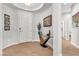 Bright entryway with wood-look tile flooring and modern decor at 69 Via Di Mello, Henderson, NV 89011