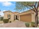 Charming single-story home featuring desert landscaping, a two-car garage, and a tile roof at 69 Via Di Mello, Henderson, NV 89011