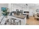 Modern kitchen with stainless steel appliances, stone countertops, and an eat-in bar with comfortable stools for dining at 69 Via Di Mello, Henderson, NV 89011