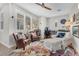 Bright living room featuring comfortable seating, a decorative rug, and natural light from the window at 69 Via Di Mello, Henderson, NV 89011