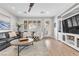 Comfortable living space with wood floors, modern furnishings, and large windows at 69 Via Di Mello, Henderson, NV 89011