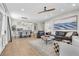Open-concept living area with wood floors, neutral tones, and modern furnishings at 69 Via Di Mello, Henderson, NV 89011