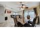 Well-lit dining area with a large table, seating for six, and sliding glass doors at 7341 Girard Dr, Las Vegas, NV 89147