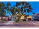 Charming single-story home featuring a well-manicured front yard and attached garage at 7341 Girard Dr, Las Vegas, NV 89147
