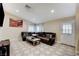 Bright living room with large windows, a comfortable sectional, and a view of the entry at 7341 Girard Dr, Las Vegas, NV 89147