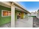 Inviting covered patio features modern concrete and string lights for outdoor relaxation and entertaining at 7341 Girard Dr, Las Vegas, NV 89147