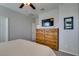 Bedroom view with carpet and a large wooden dresser with a TV above at 7712 Bandon Cliffs St, North Las Vegas, NV 89084