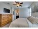Bedroom featuring a large dresser, a TV, and neutral tones at 7712 Bandon Cliffs St, North Las Vegas, NV 89084
