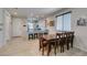 Bright dining area flows into kitchen, featuring tile floors and an open-concept feel, providing easy access to the outdoors at 7712 Bandon Cliffs St, North Las Vegas, NV 89084