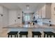 Spacious kitchen with island and granite countertops; perfect for casual dining and entertaining at 7712 Bandon Cliffs St, North Las Vegas, NV 89084