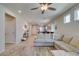 Spacious living room showing open floor plan and kitchen, plus comfortable seating with neutral decor at 7712 Bandon Cliffs St, North Las Vegas, NV 89084