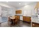 Classic kitchen boasts granite countertops, wood cabinets, and tile flooring at 7828 Morning Flower Ln, Las Vegas, NV 89129