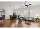 Open concept living room and dining area with hardwood floors and natural light at 7828 Morning Flower Ln, Las Vegas, NV 89129