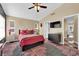 Stylish bedroom featuring a plush bed, decorative wallpaper, and ample natural light at 7845 Scammons Bay Ct, Las Vegas, NV 89129