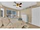 Bright bedroom with a ceiling fan, natural light, and serene decor for relaxation at 7845 Scammons Bay Ct, Las Vegas, NV 89129