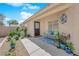 Charming front patio with desert plants, decorative bench and mat offering a warm, inviting welcome at 7845 Scammons Bay Ct, Las Vegas, NV 89129