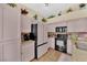 Updated kitchen with black appliances, bright cabinets, and granite countertops at 7845 Scammons Bay Ct, Las Vegas, NV 89129