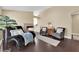 Comfortable living room boasts hardwood floors, a modern fireplace, and stylish seating, perfect for relaxing at 7845 Scammons Bay Ct, Las Vegas, NV 89129