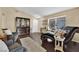 Inviting living room features hardwood floors, stylish furnishings, and a built-in display case for a cozy atmosphere at 7845 Scammons Bay Ct, Las Vegas, NV 89129