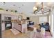 Open-concept living space with an eat-in kitchen flowing into a comfortable living room with a fireplace at 7845 Scammons Bay Ct, Las Vegas, NV 89129