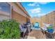 Secluded outdoor patio area surrounded by lush plants and a privacy screen perfect for relaxation at 7845 Scammons Bay Ct, Las Vegas, NV 89129