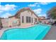 The backyard boasts a refreshing pool with a surrounding patio for relaxing and enjoying the outdoors at 7845 Scammons Bay Ct, Las Vegas, NV 89129