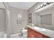 Well-lit bathroom features granite counters, framed art, and updated fixtures at 7950 W Flamingo Rd # 1044, Las Vegas, NV 89147