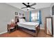Bright bedroom with a queen bed and dark wood furnishings at 7950 W Flamingo Rd # 1044, Las Vegas, NV 89147