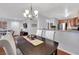Inviting dining area with stylish chandelier and colorful table runner at 7950 W Flamingo Rd # 1044, Las Vegas, NV 89147