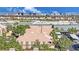 Beautiful condo complex with terracotta roofs, lush landscaping, and a stunning view of the Las Vegas city skyline at 7950 W Flamingo Rd # 1044, Las Vegas, NV 89147