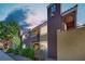 Beautiful two-story condo with manicured landscaping, balconies, and a stucco exterior under a cloudy sky at 7950 W Flamingo Rd # 1044, Las Vegas, NV 89147