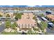 Charming condo complex featuring covered parking, terracotta roofs, lush landscaping, and stunning views of the city skyline at 7950 W Flamingo Rd # 1044, Las Vegas, NV 89147