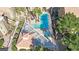 Resort-style pool with lounge areas and covered seating, surrounded by greenery at 7950 W Flamingo Rd # 1044, Las Vegas, NV 89147