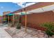 Brick wall enclosed backyard with an outdoor patio area at 8117 Discovery Point St, Las Vegas, NV 89139