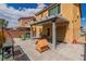 View of the backyard featuring a covered patio, brick pavers, grill, and dog house at 8117 Discovery Point St, Las Vegas, NV 89139