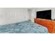 Bedroom with double closets, TV, and dark wood dresser at 8117 Discovery Point St, Las Vegas, NV 89139