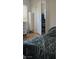 Cozy bedroom features a closet, blinds, and laminate floors at 8117 Discovery Point St, Las Vegas, NV 89139