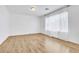 A clean, brightly lit bedroom with wood-look floors and a large window at 8117 Discovery Point St, Las Vegas, NV 89139