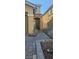 The home's facade with a brick walk way leads to a welcoming front entrance at 8117 Discovery Point St, Las Vegas, NV 89139
