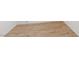 Close up of light colored wood laminate flooring with a wood grain pattern at 8117 Discovery Point St, Las Vegas, NV 89139