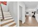 Bright hallway with wood-look tile floors leading to an open living area at 8117 Discovery Point St, Las Vegas, NV 89139