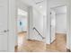 Bright hallway with wood laminate floors and white trim at 8117 Discovery Point St, Las Vegas, NV 89139