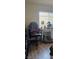 Home office features a desk and rolling chair with laminate floors and natural light at 8117 Discovery Point St, Las Vegas, NV 89139