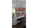 Beautiful kitchen with granite countertops, stainless steel appliances, and a breakfast bar at 8117 Discovery Point St, Las Vegas, NV 89139