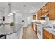 Bright kitchen with granite countertops, oak cabinets, and open layout at 8117 Discovery Point St, Las Vegas, NV 89139
