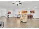 Open concept living room and kitchen offers ample space, neutral colors, and cohesive modern design at 8117 Discovery Point St, Las Vegas, NV 89139