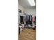 A walk-in closet with ample storage space and wood flooring, designed to maximize organization at 8117 Discovery Point St, Las Vegas, NV 89139